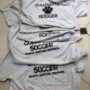 bundle of soccer t-shirts